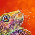 Rainbow Hare #3, painted by renowned UK wildlife artist Ann Richmond, is a soulful and striking piece of wildlife art featuring an alert and watchful hare, vividly painted in a myriad of bold, sweeping strokes set against a dry-brushed orange backdrop. Part of the Hares Collection, this artwork invites viewers to embark on a soulful exploration of the enchanting realms of hares, foxes, badgers, and more, all beautifully portrayed in Ann's distinctive style. Discover both the original work and fine-art prints of this exquisite piece at Otherwurlde.com.