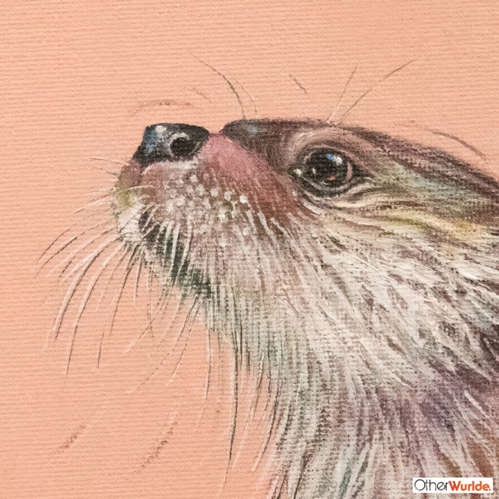 "Fly Fishing!" painted by renowned UK wildlife artist Ann Richmond, is an endearing, whimsical portrait featuring a puzzled Otter as it encounters its first dragonfly... The piece comes alive with vibrant brush strokes over a richly textured canvas, capturing the delicate interplay of nature in a moment of quiet wonder. Each piece in The Wylde Ones is rendered in Richmond’s fresh, energetic, and gestural new style—a deliberate departure from her works in The Otherwurlde Collection. The backgrounds are carefully matched to hues from a heritage palette we affectionately call “Barrow & Fall”; complementing these striking and distinctive portrayals of British wildlife. Discover the original works and fine-art prints at Otherwurlde.com.