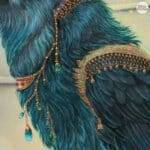 Ravensong… painted by UK fantasy artist Ann Richmond, presents a striking raven at rest within the scribing hall of the Otherwurlde. Usually intent on engraving guidance upon the legendary Pearls of Wisdom, here it pauses—head cocked, beak poised—as though weighing what the next rune should reveal. A golden shaft of light illuminates the shelves and urns around it, symbols of the knowledge entrusted to this enigmatic guardian. The painting reflects an old truth: a bird does not sing because it has an answer, but because it has a song. In this moment of stillness, the raven’s presence suggests that wisdom lies not in final answers, but in the ongoing song itself—the search, the patience, the story unfolding. Part of the Otherwurlde Collection—created in collaboration with writer Gary Hyland—Ravensong invites collectors into a world where armoured animals and hidden narratives converge. Available as the original artwork and in a limited range of fine-art prints. Discover more at Otherwurlde.com.
