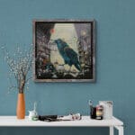 Ravensong… painted by UK fantasy artist Ann Richmond, presents a striking raven at rest within the scribing hall of the Otherwurlde. Usually intent on engraving guidance upon the legendary Pearls of Wisdom, here it pauses—head cocked, beak poised—as though weighing what the next rune should reveal. A golden shaft of light illuminates the shelves and urns around it, symbols of the knowledge entrusted to this enigmatic guardian. The painting reflects an old truth: a bird does not sing because it has an answer, but because it has a song. In this moment of stillness, the raven’s presence suggests that wisdom lies not in final answers, but in the ongoing song itself—the search, the patience, the story unfolding. Part of the Otherwurlde Collection—created in collaboration with writer Gary Hyland—Ravensong invites collectors into a world where armoured animals and hidden narratives converge. Available as the original artwork and in a limited range of fine-art prints. Discover more at Otherwurlde.com.