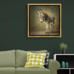 Donkey Foal, created by innovative UK digital artist Gary Hyland, captures the stunning innocence of a baby Donkey, delicately colour-tinted to harmonise with a graduated, earthy olive-green background. This enchanting piece from the Fauna Collection celebrates the purity and charm of nature through a minimalist yet captivating composition, where the subtle grey & gingery-brown accents in the Donkey's fur resonate with the backdrop. An impossibly cute and gentle vision, Donkey Foal transports us to a timeless, unspoiled realm of natural beauty, blended with a subtle twist of colour. Discover original artworks and fine-art prints from this endearing series at Otherwurlde.com.