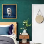 Barn Owlet, created by innovative UK digital artist Gary Hyland, captures the stunning innocence of a baby Barn Owl, delicately placed against a smoothly graduated rich sapphire-blue background. This enchanting piece from the Fauna Collection celebrates the purity and charm of nature through a minimalist yet captivating composition, where the subtle accents in the Owl's feathers resonate with the backdrop. An impossibly cute and gentle vision, Barn Owlet transports us to a timeless, unspoiled realm of natural beauty, blended with a subtle twist of colour. Discover original artworks and fine-art prints from this endearing series at Otherwurlde.com.