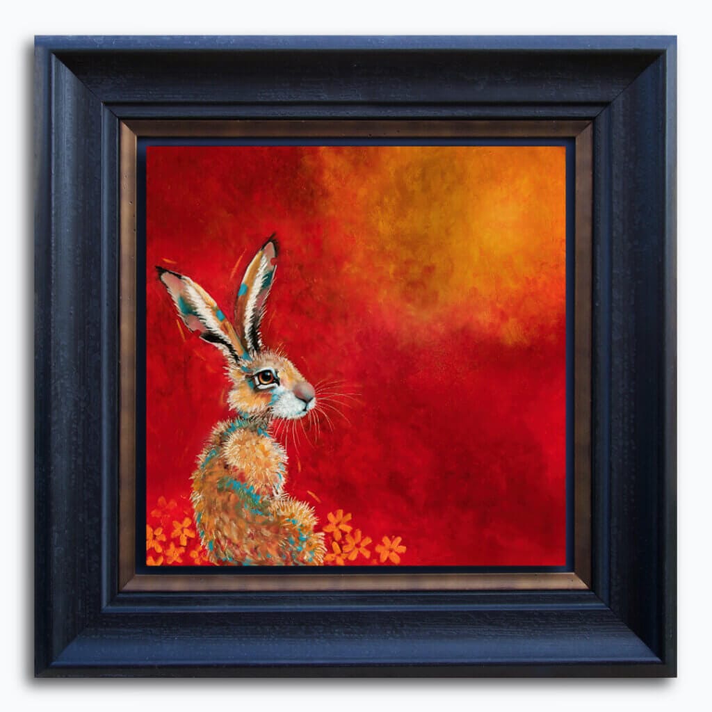 “Hare, Dryer…” presents a serene portrait of a hare at dawn, bathed in the soft warmth of a rising sun. Set against rich tones of red, yellow, and marigold, the hare rests calmly among oversized, abstracted flowers — a quietly radiant scene that speaks of warmth, stillness, and gentle renewal. Painted by renowned UK wildlife artist Ann Richmond, the artwork comes alive with vibrant brush strokes over a richly textured canvas, capturing the delicate interplay of nature in a moment of quiet wonder. Each piece in The Wylde Ones is rendered in Richmond’s fresh, energetic, and gestural new style—a deliberate departure from her works in The Otherwurlde Collection. The backgrounds are carefully matched to hues from a heritage palette we affectionately call “Barrow & Fall”; complementing these striking and distinctive portrayals of British wildlife. Discover the original works and fine-art prints at Otherwurlde.com.