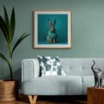 Leveret, created by innovative UK digital artist Gary Hyland, captures the stunning innocence of a baby hare, delicately colour-tinted to harmonise with a soft, graduated blue background. This enchanting piece from the Fauna Collection celebrates the purity and charm of nature through a minimalist yet captivating composition, where the blue accents in the leveret’s fur resonate with the serene backdrop. An impossibly cute and gentle vision, Leveret transports us to a timeless, unspoiled realm of natural beauty, blended with a subtle twist of colour. Discover original artworks and fine-art prints from this endearing series at Otherwurlde.com.