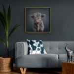 Highland Calf – Grey by innovative UK digital artist Gary Hyland captures the irresistible charm of a young Highland calf, its soft, tousled grey fur exuding a quiet elegance against a gentle, graduated petrol-blue background. This captivating piece from the Fauna Collection celebrates the endearing innocence of nature through a minimalist yet emotive composition, where delicate highlights in the calf’s coat subtly harmonise with the serene backdrop. A vision of rustic beauty and quiet grace, Highland Calf – Grey transports us to a timeless pastoral setting, infused with warmth and tranquillity. Discover original artworks and fine-art prints from this heartwarming series at Otherwurlde.com.