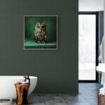 Tawny Owlet, created by innovative UK digital artist Gary Hyland, captures the stunning innocence of a baby Tawny Owl, delicately colour-tinted to harmonise with a mottled emerald-green background. This enchanting piece from the Fauna Collection celebrates the purity and charm of nature through a minimalist yet captivating composition, where the subtle green accents in the Owl's feathers resonate with the backdrop. An impossibly cute and gentle vision, Tawny Owlet transports us to a timeless, unspoiled realm of natural beauty, blended with a subtle twist of colour. Discover original artworks and fine-art prints from this endearing series at Otherwurlde.com.