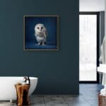 Barn Owlet, created by innovative UK digital artist Gary Hyland, captures the stunning innocence of a baby Barn Owl, delicately placed against a smoothly graduated rich sapphire-blue background. This enchanting piece from the Fauna Collection celebrates the purity and charm of nature through a minimalist yet captivating composition, where the subtle accents in the Owl's feathers resonate with the backdrop. An impossibly cute and gentle vision, Barn Owlet transports us to a timeless, unspoiled realm of natural beauty, blended with a subtle twist of colour. Discover original artworks and fine-art prints from this endearing series at Otherwurlde.com.