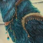 Ravensong… painted by UK fantasy artist Ann Richmond, presents a striking raven at rest within the scribing hall of the Otherwurlde. Usually intent on engraving guidance upon the legendary Pearls of Wisdom, here it pauses—head cocked, beak poised—as though weighing what the next rune should reveal. A golden shaft of light illuminates the shelves and urns around it, symbols of the knowledge entrusted to this enigmatic guardian. The painting reflects an old truth: a bird does not sing because it has an answer, but because it has a song. In this moment of stillness, the raven’s presence suggests that wisdom lies not in final answers, but in the ongoing song itself—the search, the patience, the story unfolding. Part of the Otherwurlde Collection—created in collaboration with writer Gary Hyland—Ravensong invites collectors into a world where armoured animals and hidden narratives converge. Available as the original artwork and in a limited range of fine-art prints. Discover more at Otherwurlde.com.