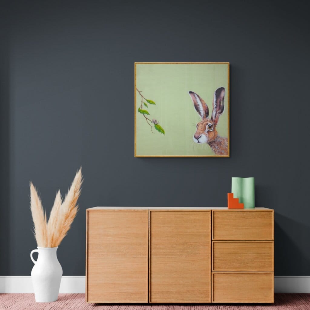 "Life in the Slow Lane..." painted by renowned UK wildlife artist Ann Richmond, is an endearing, whimsical portrait featuring a puzzled Hare as it encounters a snail... The piece comes alive with vibrant brush strokes over a richly textured canvas, capturing the delicate interplay of nature in a moment of quiet wonder. Each piece in The Wylde Ones is rendered in Richmond’s fresh, energetic, and gestural new style—a deliberate departure from her works in The Otherwurlde Collection. The backgrounds are carefully matched to hues from a heritage palette we affectionately call “Barrow & Fall”; complementing these striking and distinctive portrayals of British wildlife. Discover the original works and fine-art prints at Otherwurlde.com.