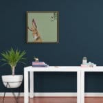 'Harebell...' features a vigilant Hare, who has suddenly heard the 'BUZZ!' of a bumblebee, but can't place the source: all he can see is the distinctive trumpet of a Morning Glory flower... Can YOU spot it? Painted by renowned UK wildlife artist Ann Richmond, the artwork comes alive with vibrant brush strokes over a richly textured canvas, capturing the delicate interplay of nature in a moment of quiet wonder. Each piece in The Wylde Ones is rendered in Richmond’s fresh, energetic, and gestural new style—a deliberate departure from her works in The Otherwurlde Collection. The backgrounds are carefully matched to hues from a heritage palette we affectionately call “Barrow & Fall”; complementing these striking and distinctive portrayals of British wildlife. Discover the original works and fine-art prints at Otherwurlde.com.