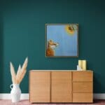 'Sunny Side Up!' This beautiful painting celebrates the noble fox at his best, as he stares awestruck at a glowing sunflower in all its glory. While it's true that you should 'never stare at the sun', we'd make an exception for this one! Painted by renowned UK wildlife artist Ann Richmond, the artwork comes alive with vibrant brush strokes over a richly textured canvas, capturing the delicate interplay of nature in a moment of quiet wonder. Each piece in The Wylde Ones is rendered in Richmond’s fresh, energetic, and gestural new style—a deliberate departure from her works in The Otherwurlde Collection. The backgrounds are carefully matched to hues from a heritage palette we affectionately call “Barrow & Fall”; complementing these striking and distinctive portrayals of British wildlife. Discover the original works and fine-art prints at Otherwurlde.com.