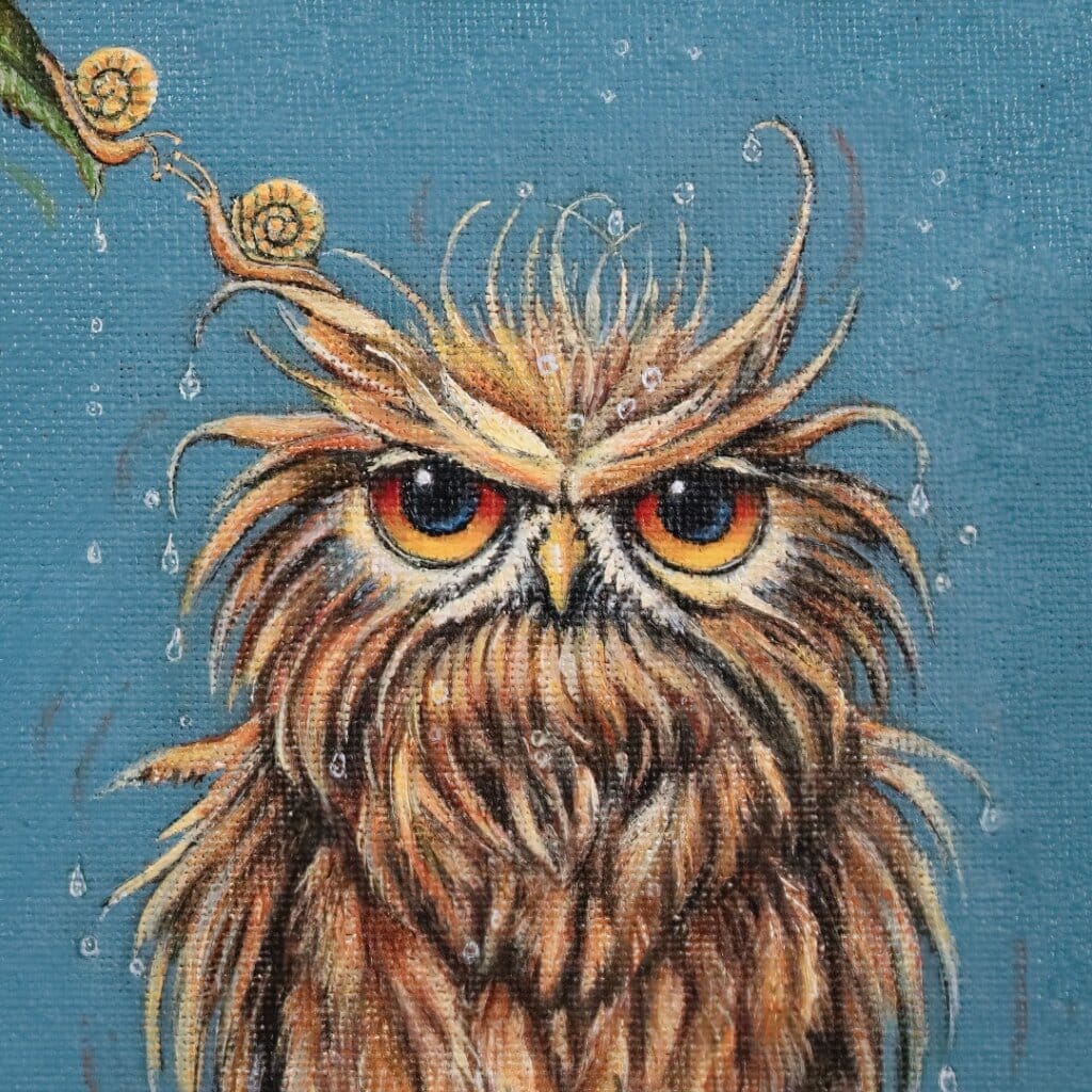 'Love in a Cold Climate...' is a loose sequel to the earlier piece 'Big Drip, Little Owl!'. In this latest painting, the featured character is a beautifully painted Horned Owl that has a little yellow snail sitting at the tip of one of its ears. Look closer: the snail has made contact with another that's balanced on an overhanging leaf! Little wonder that the owl looks so grumpy! Painted by renowned UK wildlife artist Ann Richmond, the artwork comes alive with vibrant brush strokes over a richly textured canvas, capturing the delicate interplay of nature in a moment of quiet wonder. Each piece in The Wylde Ones is rendered in Richmond’s fresh, energetic, and gestural new style—a deliberate departure from her works in The Otherwurlde Collection. The backgrounds are carefully matched to hues from a heritage palette we affectionately call “Barrow & Fall”; complementing these striking and distinctive portrayals of British wildlife. Discover the original works and fine-art prints at Otherwurlde.com.