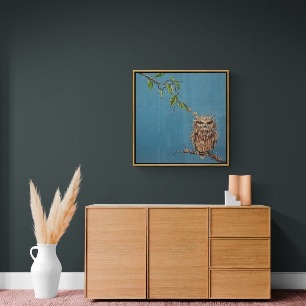 'Love in a Cold Climate...' is a loose sequel to the earlier piece 'Big Drip, Little Owl!'. In this latest painting, the featured character is a beautifully painted Horned Owl that has a little yellow snail sitting at the tip of one of its ears. Look closer: the snail has made contact with another that's balanced on an overhanging leaf! Little wonder that the owl looks so grumpy! Painted by renowned UK wildlife artist Ann Richmond, the artwork comes alive with vibrant brush strokes over a richly textured canvas, capturing the delicate interplay of nature in a moment of quiet wonder. Each piece in The Wylde Ones is rendered in Richmond’s fresh, energetic, and gestural new style—a deliberate departure from her works in The Otherwurlde Collection. The backgrounds are carefully matched to hues from a heritage palette we affectionately call “Barrow & Fall”; complementing these striking and distinctive portrayals of British wildlife. Discover the original works and fine-art prints at Otherwurlde.com.