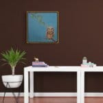 'Love in a Cold Climate...' is a loose sequel to the earlier piece 'Big Drip, Little Owl!'. In this latest painting, the featured character is a beautifully painted Horned Owl that has a little yellow snail sitting at the tip of one of its ears. Look closer: the snail has made contact with another that's balanced on an overhanging leaf! Little wonder that the owl looks so grumpy! Painted by renowned UK wildlife artist Ann Richmond, the artwork comes alive with vibrant brush strokes over a richly textured canvas, capturing the delicate interplay of nature in a moment of quiet wonder. Each piece in The Wylde Ones is rendered in Richmond’s fresh, energetic, and gestural new style—a deliberate departure from her works in The Otherwurlde Collection. The backgrounds are carefully matched to hues from a heritage palette we affectionately call “Barrow & Fall”; complementing these striking and distinctive portrayals of British wildlife. Discover the original works and fine-art prints at Otherwurlde.com.