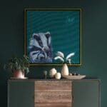 'Flutterby…' captures a tender woodland moment as two young badger cubs nestle into their mother’s warm embrace. Wide-eyed with curiosity, they watch an ethereal Chalk Blue butterfly drift past, while their mother offers the calm assurance that all is well in their little world. A scene full of mischief, warmth, and woodland charm Painted by renowned UK wildlife artist Ann Richmond, the artwork comes alive with vibrant brush strokes over a richly textured canvas, capturing the delicate interplay of nature in a moment of quiet wonder. Each piece in The Wylde Ones is rendered in Richmond’s fresh, energetic, and gestural new style—a deliberate departure from her works in The Otherwurlde Collection. The backgrounds are carefully matched to hues from a heritage palette we affectionately call “Barrow & Fall”; complementing these striking and distinctive portrayals of British wildlife. Discover the original works and fine-art prints at Otherwurlde.com.