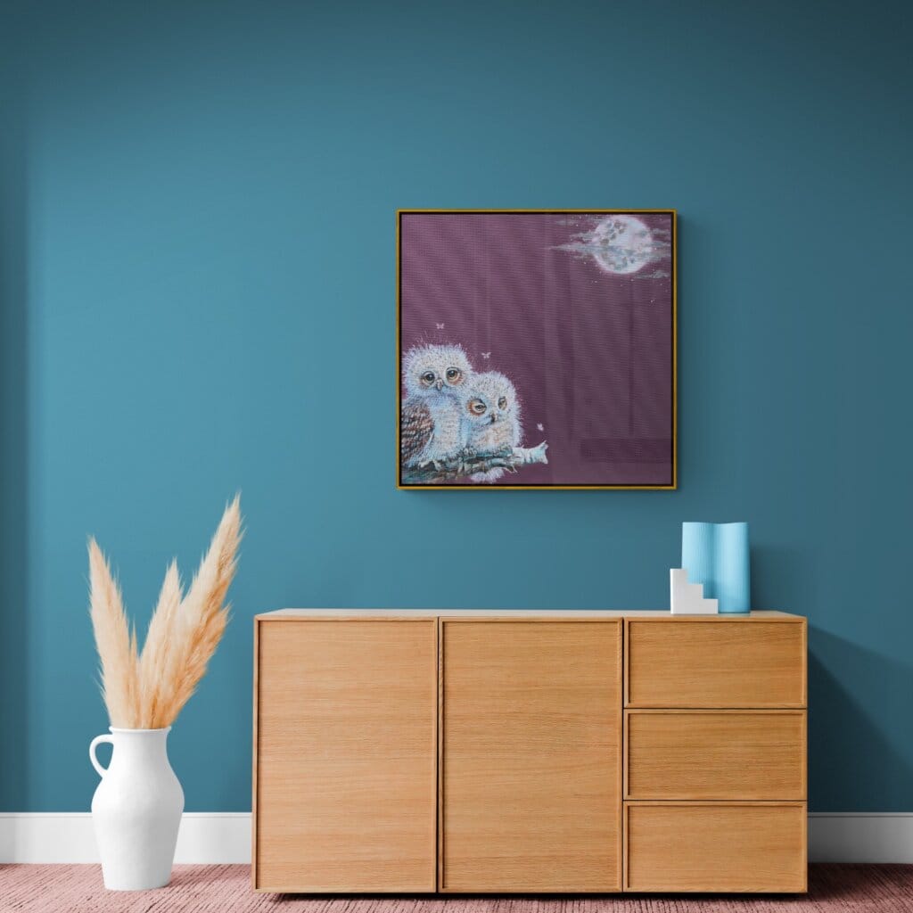 'Out on a Limb…' captures a tender moment as two tawny owl chicks perch together on a moonlit branch. Clouds drift lazily across the night sky while delicate moths dance in the glow — a gentle, pastoral scene full of quiet courage and countryside charm. Painted by renowned UK wildlife artist Ann Richmond, the artwork comes alive with vibrant brush strokes over a richly textured canvas, capturing the delicate interplay of nature in a moment of quiet wonder. Each piece in The Wylde Ones is rendered in Richmond’s fresh, energetic, and gestural new style—a deliberate departure from her works in The Otherwurlde Collection. The backgrounds are carefully matched to hues from a heritage palette we affectionately call “Barrow & Fall”; complementing these striking and distinctive portrayals of British wildlife. Discover the original works and fine-art prints at Otherwurlde.com.