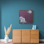 'Out on a Limb…' captures a tender moment as two tawny owl chicks perch together on a moonlit branch. Clouds drift lazily across the night sky while delicate moths dance in the glow — a gentle, pastoral scene full of quiet courage and countryside charm. Painted by renowned UK wildlife artist Ann Richmond, the artwork comes alive with vibrant brush strokes over a richly textured canvas, capturing the delicate interplay of nature in a moment of quiet wonder. Each piece in The Wylde Ones is rendered in Richmond’s fresh, energetic, and gestural new style—a deliberate departure from her works in The Otherwurlde Collection. The backgrounds are carefully matched to hues from a heritage palette we affectionately call “Barrow & Fall”; complementing these striking and distinctive portrayals of British wildlife. Discover the original works and fine-art prints at Otherwurlde.com.