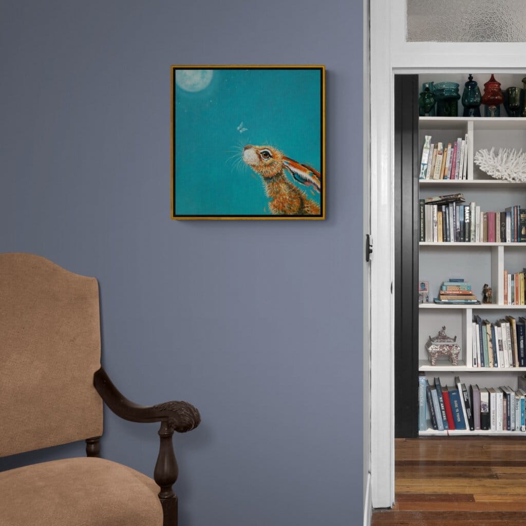 “Moongazing…” captures a quietly evocative moment as a hare stretches its neck, transfixed by the glow of a full moon. A pale moth drifts past its nose, unnoticed, as the hardy creature remains utterly absorbed in the mystery of the night sky. Painted by renowned UK wildlife artist Ann Richmond, the artwork comes alive with vibrant brush strokes over a richly textured canvas, capturing the delicate interplay of nature in a moment of quiet wonder. Each piece in The Wylde Ones is rendered in Richmond’s fresh, energetic, and gestural new style—a deliberate departure from her works in The Otherwurlde Collection. The backgrounds are carefully matched to hues from a heritage palette we affectionately call “Barrow & Fall”; complementing these striking and distinctive portrayals of British wildlife. Discover the original works and fine-art prints at Otherwurlde.com.