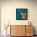 “Morag Munchin’” portrays a wonderfully characterful ginger Highland cow, contentedly chewing an ear of barley with a winning, slightly cheeky tilt of the head. As she munches, a delicate pale-pink butterfly drifts in to settle on one of her horns, completing a scene full of warmth and gentle countryside charm. Painted by renowned UK wildlife artist Ann Richmond, the artwork comes alive with vibrant brush strokes over a richly textured canvas, capturing the delicate interplay of nature in a moment of quiet wonder. Each piece in The Wylde Ones is rendered in Richmond’s fresh, energetic, and gestural new style—a deliberate departure from her works in The Otherwurlde Collection. The backgrounds are carefully matched to hues from a heritage palette we affectionately call “Barrow & Fall”; complementing these striking and distinctive portrayals of British wildlife. Discover the original works and fine-art prints at Otherwurlde.com.