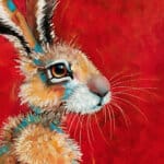 “Hare, Dryer…” presents a serene portrait of a hare at dawn, bathed in the soft warmth of a rising sun. Set against rich tones of red, yellow, and marigold, the hare rests calmly among oversized, abstracted flowers — a quietly radiant scene that speaks of warmth, stillness, and gentle renewal. Painted by renowned UK wildlife artist Ann Richmond, the artwork comes alive with vibrant brush strokes over a richly textured canvas, capturing the delicate interplay of nature in a moment of quiet wonder. Each piece in The Wylde Ones is rendered in Richmond’s fresh, energetic, and gestural new style—a deliberate departure from her works in The Otherwurlde Collection. The backgrounds are carefully matched to hues from a heritage palette we affectionately call “Barrow & Fall”; complementing these striking and distinctive portrayals of British wildlife. Discover the original works and fine-art prints at Otherwurlde.com.